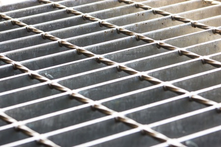 Slip and Fall on Slippery Sidewalk Grate Violated Codes, Expert Says