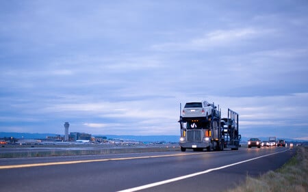 Car Slides Off Carrier Trailer Causing Highway Accident